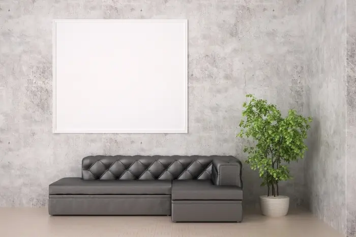 Single Sofa dan Sofa L dengan Tambahan Tanaman Hijau di Sudut Ruangan